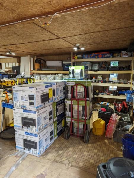 Image of a lot of microwaves in a warehouse